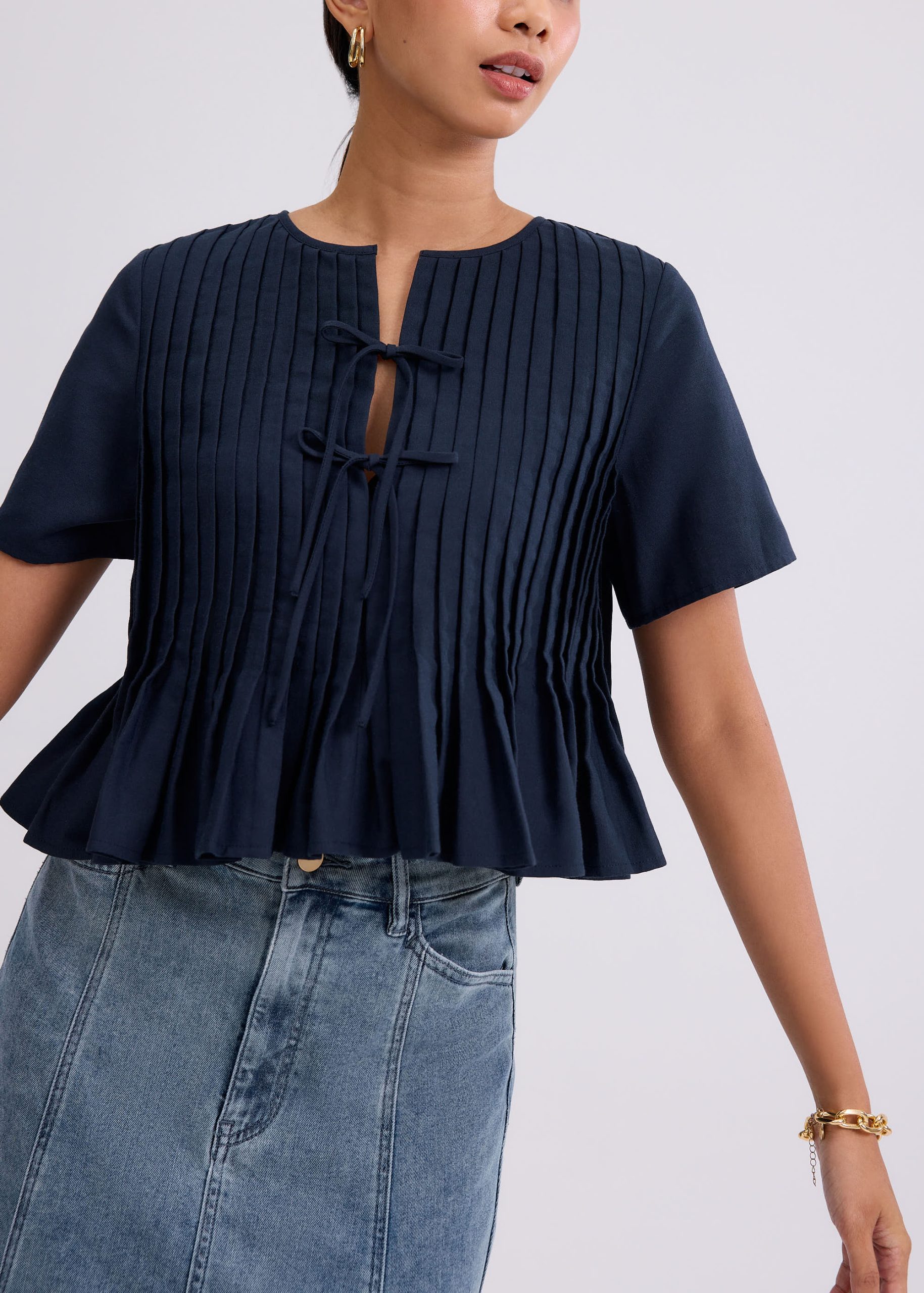 Oxford Pintuck Notched Peplum Top